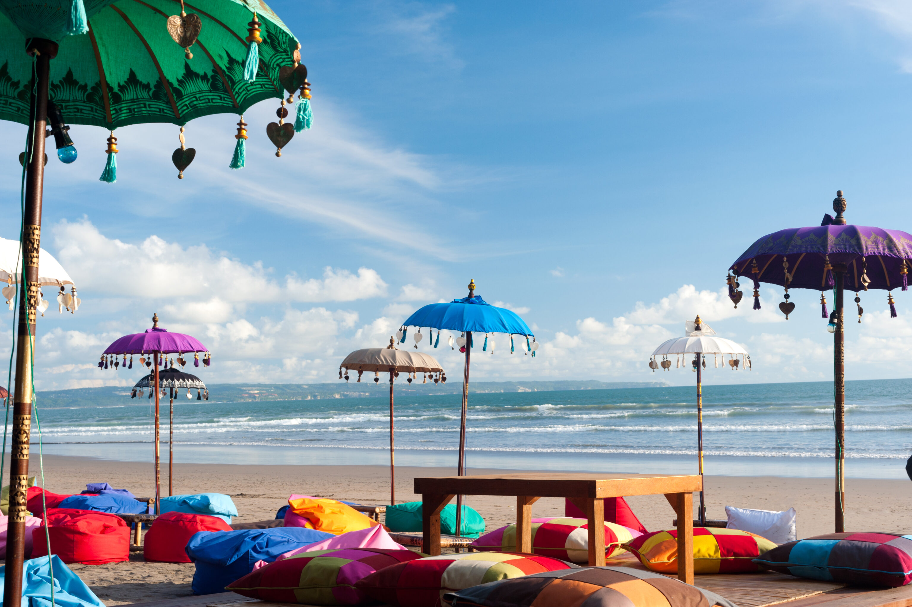 Colorful,Beach,Umbrellas,And,Pillows,In,Kuta,,Bali